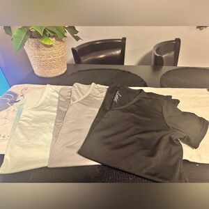 3 Amazon Essentials dry fit v-neck t shirts for women.